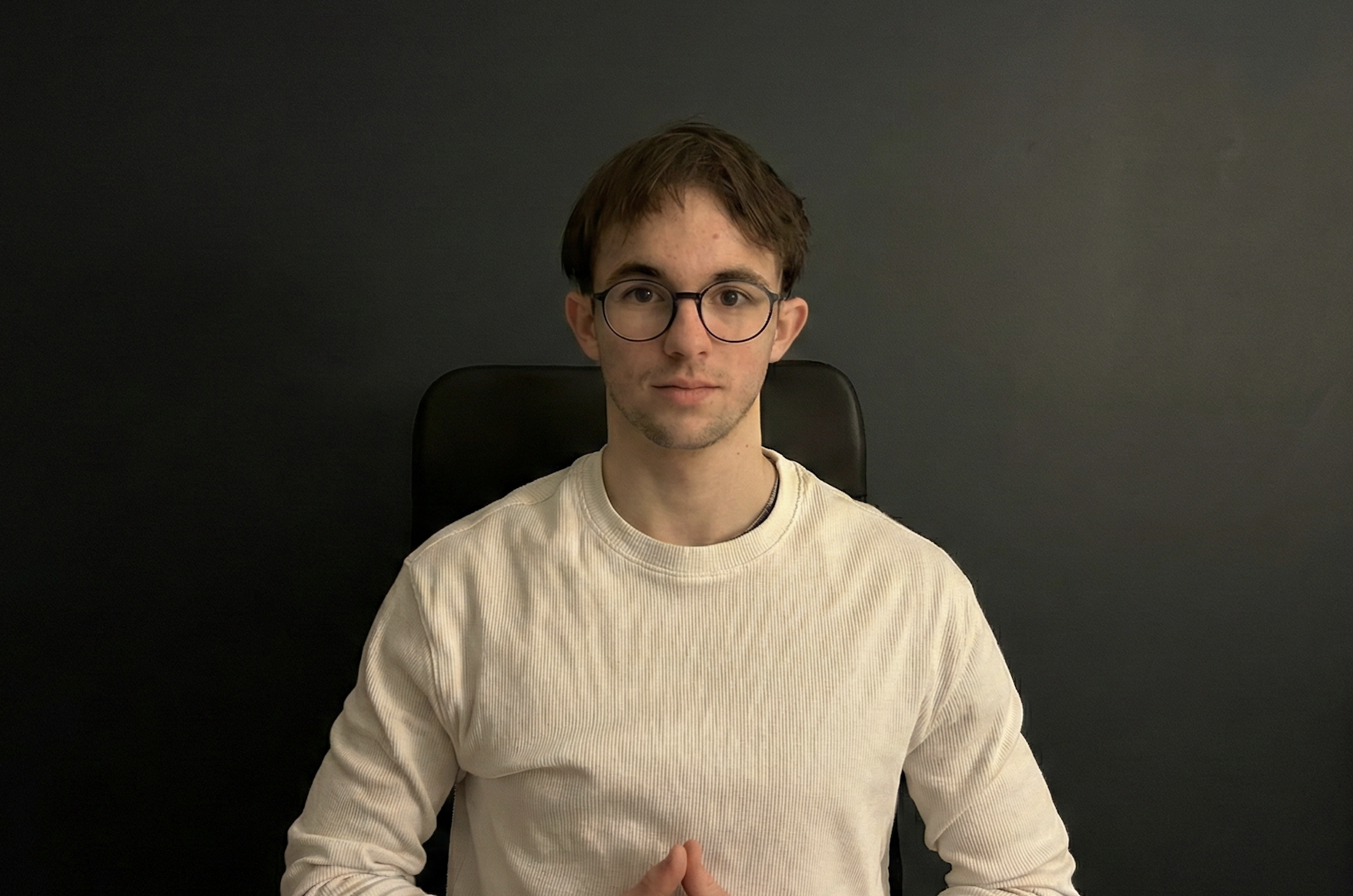 Mieszko Szczerbiak, Founder of MLabsAi, in a professional office setting